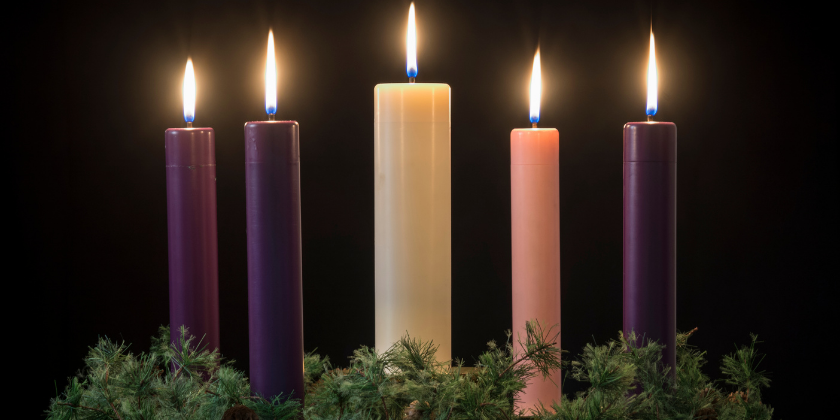 purple, pink and white candles with a garland wreath