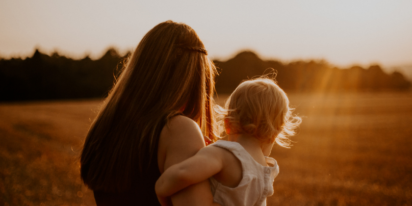 Mom holding child